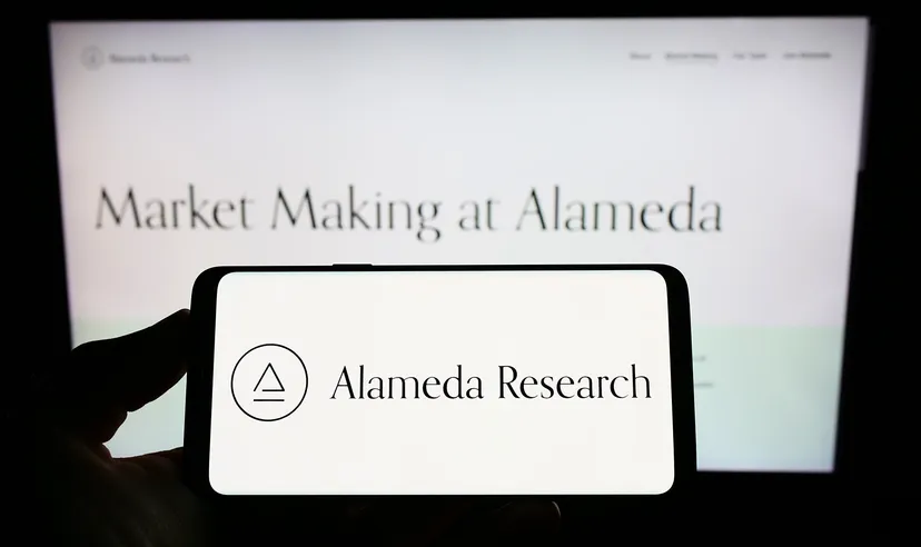 Alameda Research logo on smartphone and computer screen 