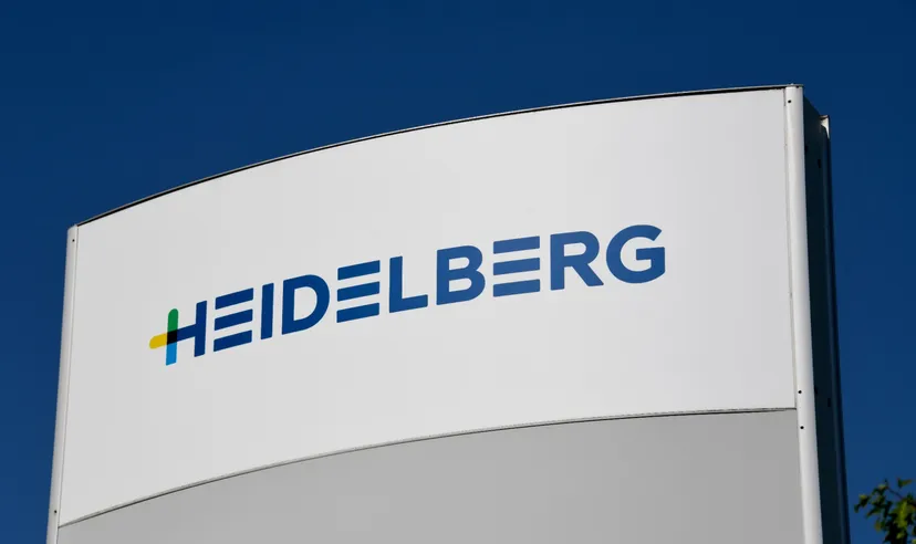Heidelberg logo on a sign against a blue sky.