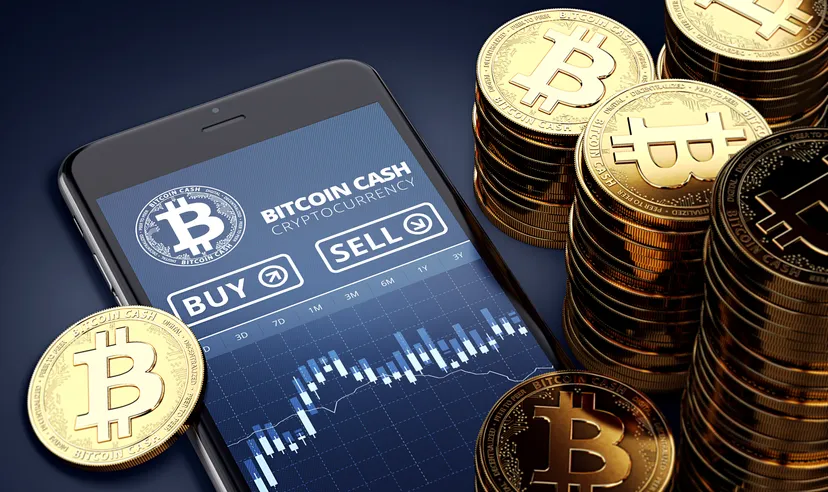Bitcoin cash tokens next to a smartphone with trading bitcoin cash