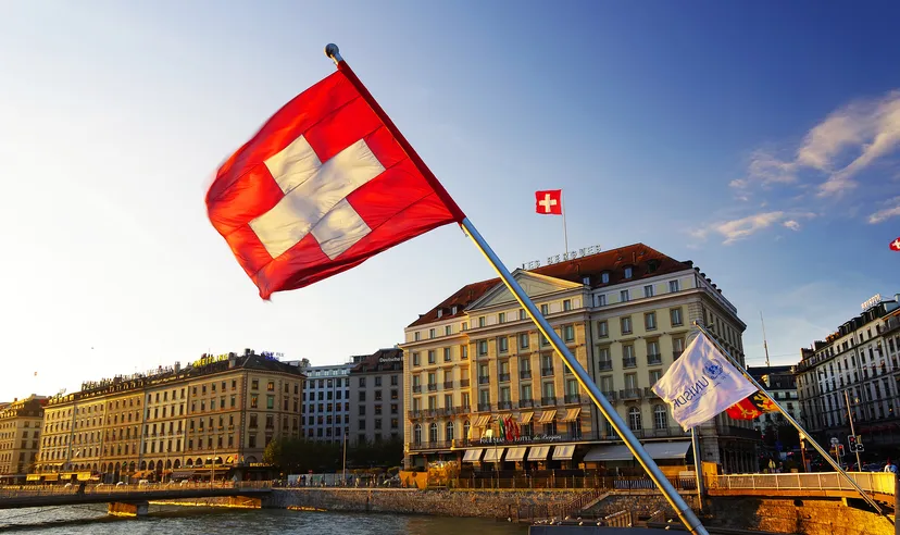 Flag of the Geneva Canton and flag of Switerland in the city center of Geneva on the Mont Blanc Bridge