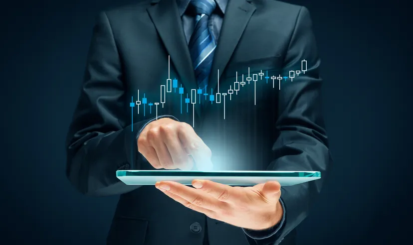 Conceptual image of crypto market leaders Image of a man in a suit making digital adjustments to a laptop or screen