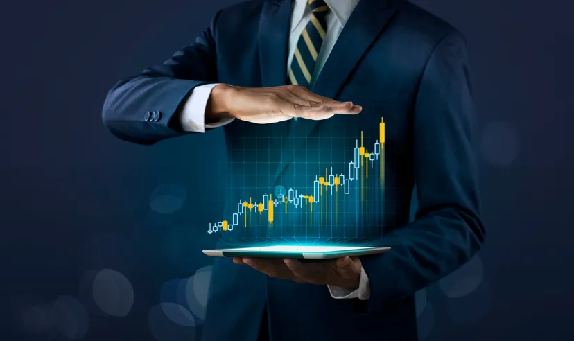 S&P 500 vs US Tech 100: Recession outlook The concept of business growth, progress or success. A businessman shows a growing stock of a virtual hologram on a dark background.