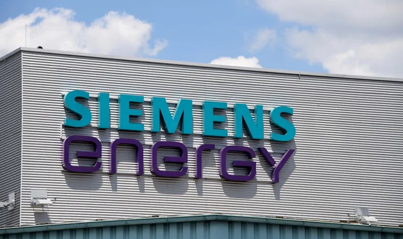 Siemens Energy logo displayed on the exterior of an industrial building against a blue sky