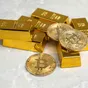 Oro e Bitcoin nel 2025: correlazione e come l’oro potrebbe suggerire timing di investimento in Bitcoin