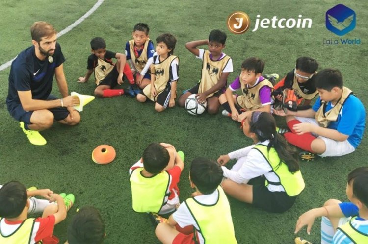 Jetcoin Young football talents in a huddle