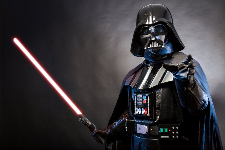 Darth Vader is a character from the Star Wars universe, owned by Disney – Credit: Shutterstock A costumed character from the Star Wars universe, owned by Disney