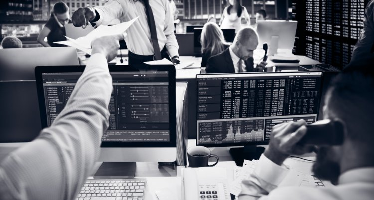 Traders in trading room Traders in trading room