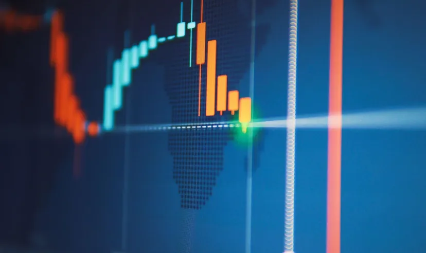 Close-up of a digital candlestick trading chart showing a bearish price movement with declining candles and market indicators.