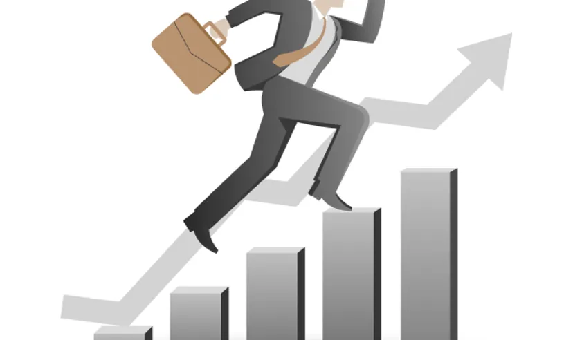 A man with a briefcase in his hand climbing up a bar chart